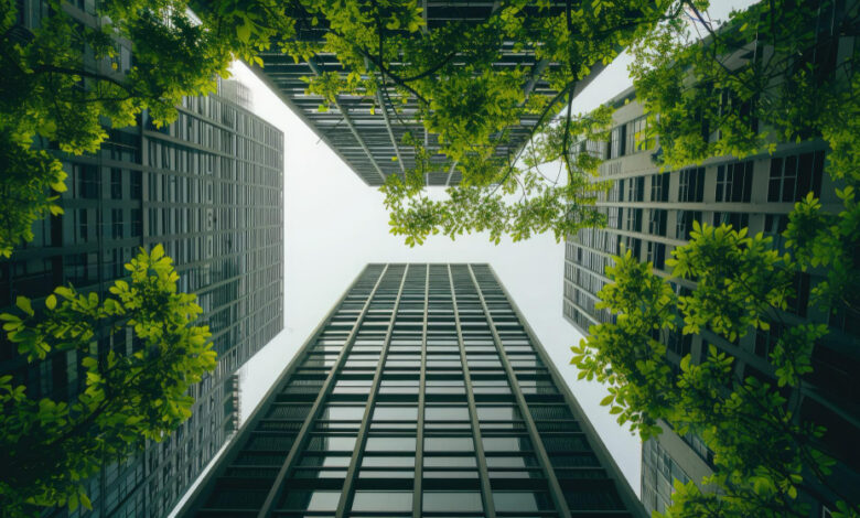Modern office buildings with green facades, symbolizing the integration of sustainability and ESG principles in Global Capability Centers' real estate strategies.